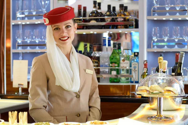 A flight attendant in an aircraft cabin