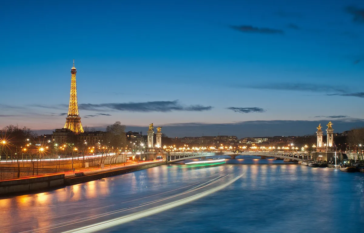 The Eiffel Tower and Pont Alexandre III in Paris at night