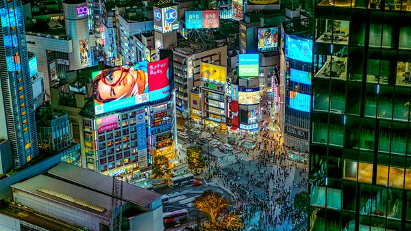Shibuya crossing in Tokyo seen from above at dusk